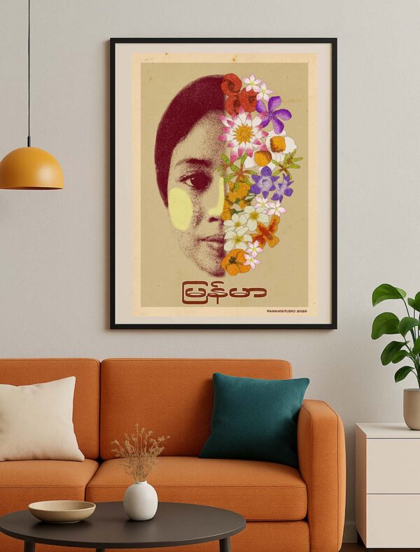 A Face of Flowers poster displayed in a frame within a Myanmar-inspired interior decorated with natural textures and local influences.